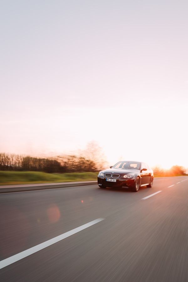 Vehicle on the road in evening light