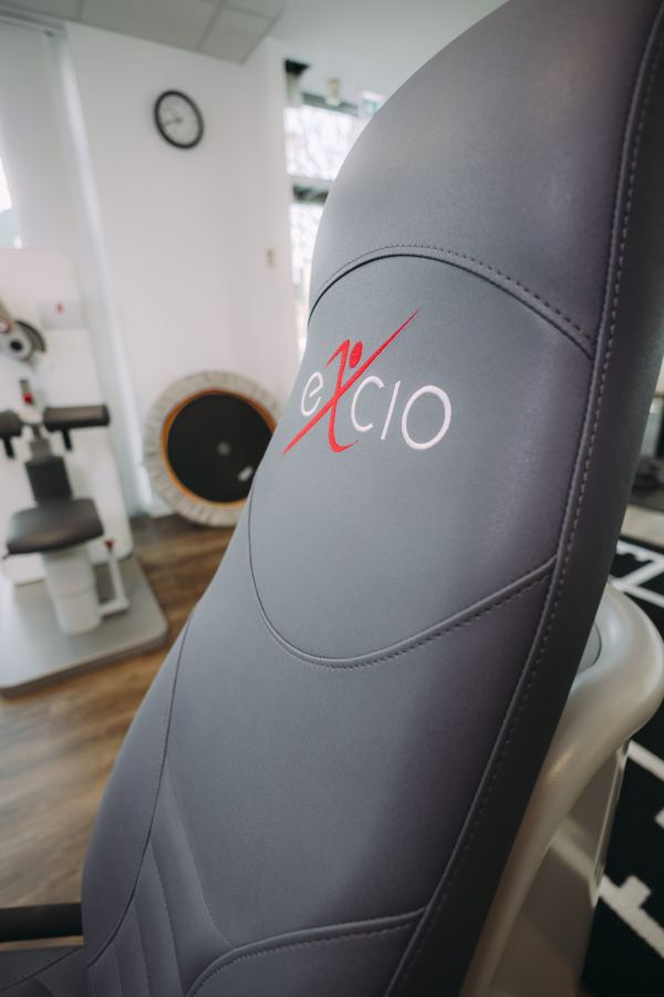 Detail: the excio logo on the upholstery