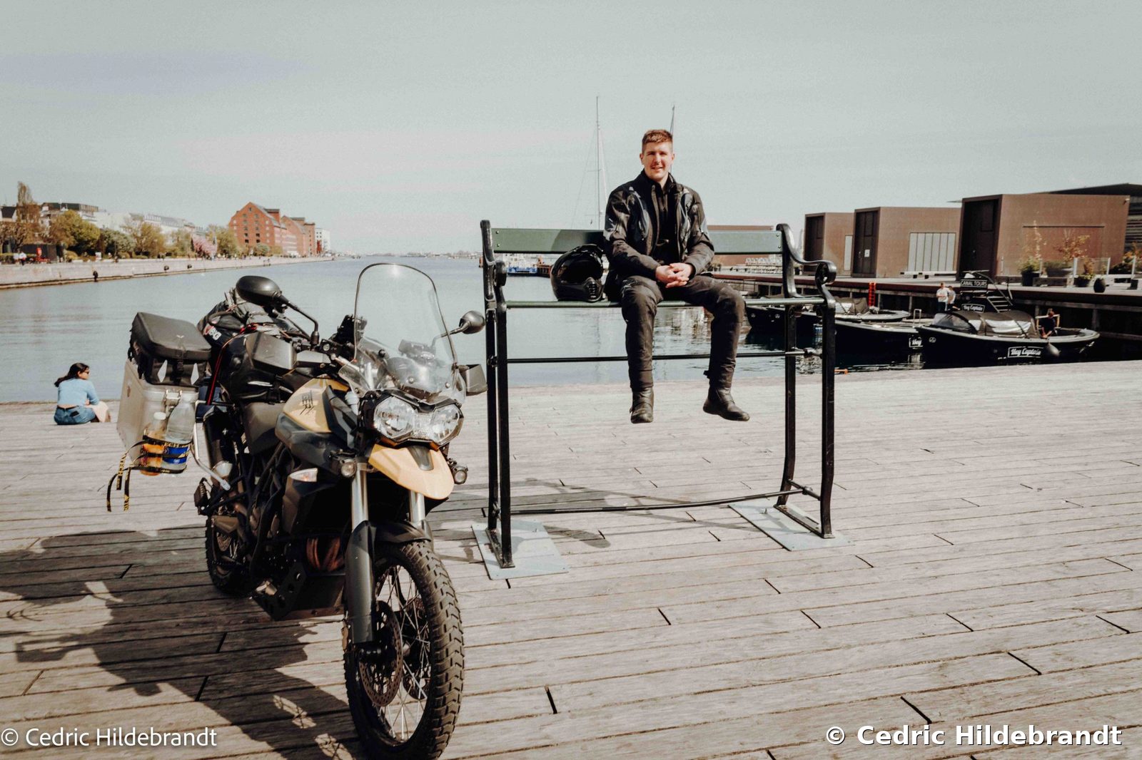 Triumph Tiger 800 XC from 2012, fully loaded with travel luggage at the harbour